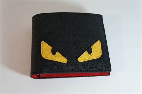 fendi wallet eyes monster|Fendi monster eye bifold wallet.